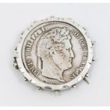 A late Victorian 5 Fancs 1840 coin, set within a fancy white metal brooch mount with beaded rim,