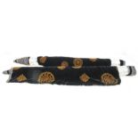 Two part-rolls of black velvet with a brown lace motif; 2 bolts on card of white Nottingham lace;