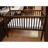 A 19th century oak child's crib / cot