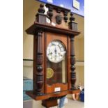 A late 19th Century mahogany wall clock