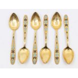 A cased set of six Russian silver-gilt teaspoons with enamel decoration depicting flowers, marked