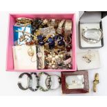 An assortment of costume jewellery: various items such as bracelets, rings, earring and watches, and