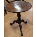 A George III mahogany tripod wine table with tilt top