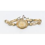 A vintage 9ct gold ladies Vertex wristwatch, with round gilt and white tone dial, case approx 22mm,