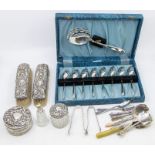 An Edwardian four piece Birmingham silver mounted dressing table set, along with plated flatware (