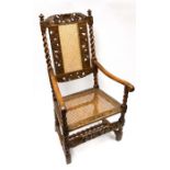 Late 17th century Dutch-inspired walnut armchair with bergere backrest and turned supports.