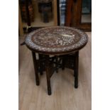 An Indian mid 20th Century hardwood side table, with inlaid peacock detail