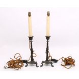 Pair of bronze Regency candlesticks with lions feet supports, grape vine detail. Converted to
