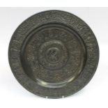 A 19th Century bronze charger depicting figures hunting and feasting, marked verso for John