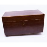 A rectangular Mahogany tea caddy with three compartments inside, two with hinged lids, other with