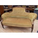 A late Victorian parlour sofa chair, button-back and covered with mustard fabric.