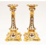 A pair of Royal Crown Derby candlesticks in 1128 Imari pattern. Good condition.