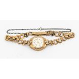 A ladies 9ct gold Rotary vintage wristwatch, round silvered dial with applied gilt number and