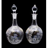 A pair of nut moulded Bohemian liqueur enamelled shaft and globe decanters, circa 1875-1885,