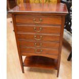 An Edwardian mahogany music cabinet with five drop-down sheet music drawers