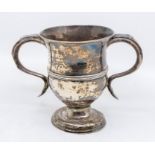 A George II silver two handled loving cup, central mid rib, hallmarked by William Shaw II and