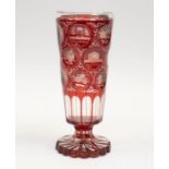 A Bohemian red flash glass vase with German land marks and flowers etched, 8" high approx in good