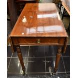 A Georgian style mahogany Pembroke table, drop leaf with single frieze drawer, on tapering legs with
