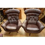 A pair of 1960s' Swedish leather swivel armchairs by Swedfurn Slätte Möbler AB