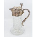A Victorian style silver and cut glass claret jug, with silver collar, lid and handle, decorated