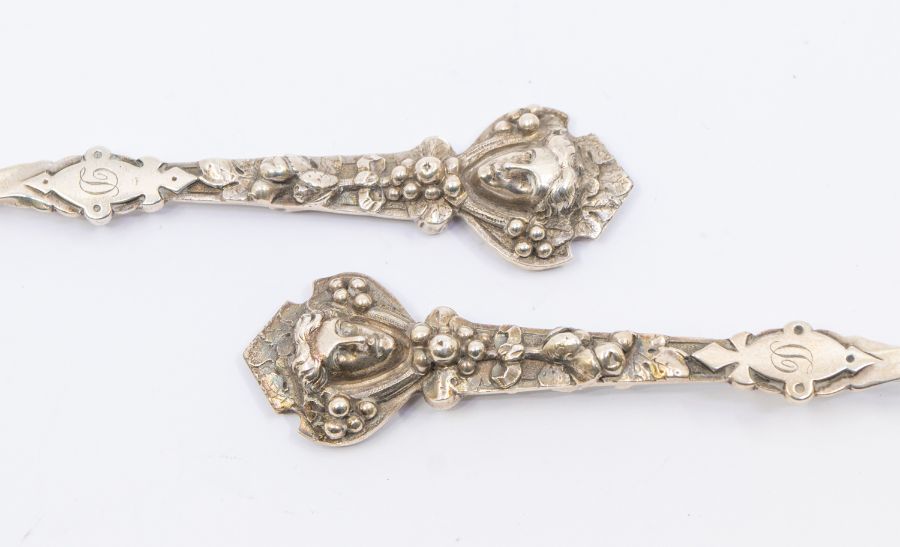 A pair of Victorian silver serving spoons with twisted stem, mask and berry ornamentation to the - Image 3 of 3