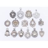 A collection of fifteen silver fob medallions, various shapes and designs, three with double sided