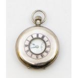 A 1935 jubilee silver half hunter pocket watch, comprising a signed white enamel dial with Roman