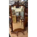 A 19th century, wall-hanging, on stand, mahogany dressing mirror with original glass, scrolled