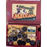 Meccano: A boxed Meccano Set No. 7 with manuals and boxed clockwork motor with key. Box worn but