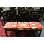 A set of eight early 20th century Japanese dining chairs, black lacquered six single and two carvers
