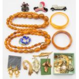 A collection of costume jewellery including a pair of silver and amber earrings, (one chipped both