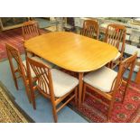 A teak mid century extending table and 6 chairs to include 1 carver, 2 extra leaves. Fabric cushions