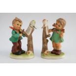 Two Hummel/Goebel style figures depicting children with violins  (violin broken off little girls