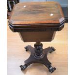 A mid-19th century mahogany sewing table with carved stem on four splayed legs with castors