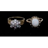 An opal and diamond 18ct gold cluster comprising a cluster of small round cabochon opals with four