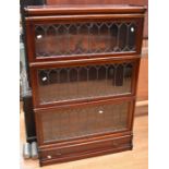 A 3 tier Globe Wernicke type mahogany bookcase, having three lead glazed doors and lower single