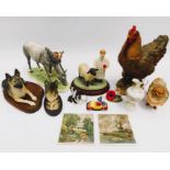 A collection of small and miniature resin dog animals, miniature porcelain pieces including
