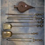 18th Century brass Georgian fire irons with claw and ball handles along with a Victorian brass set