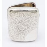 A Victorian silver cigarette case with gilt interior and engraved floral and foliage decoration,