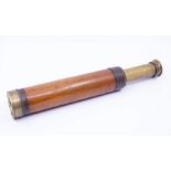 A wood and brass telescope