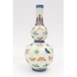 A 20th Century Chinese double gourd vase, decorated with butterflies