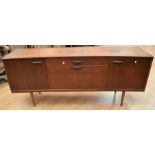 1970s' teak sideboard with three cupboard doors and a single drawer, together with a teak shelving