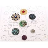 1 card of 7 buttons, to include: a Gay 1890s brass and glass, a large sapphire and white paste, a