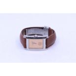 A Baume & Mercier gents wristwatch, comprising a steel rectangular case, bronzed dial with dot and