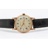 A vintage Helvetia gents 9ct gold wristwatch, comprising a round silvered dial with Arabic and dot
