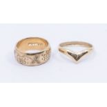 Two 9ct gold rings including a wishbone, size P and an engraved wide wedding band, width approx 8mm,