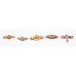 A collection of early 20th century brooches to include four 9ct gold brooches, two set with small
