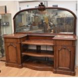 A large red mahogany mid-Victorian mirror-backed sideboard with two pedestal cupboards, one either