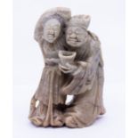 An Oriental Soapstone figure of a couple