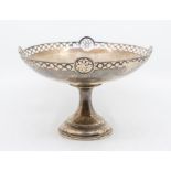 A George V silver footed tazza with pierced circular and floral like decoration to rim, hallmarked